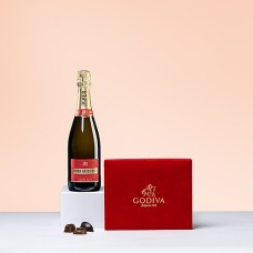 Scatola di velluto rosso Godiva e champagne Piper Heidsieck