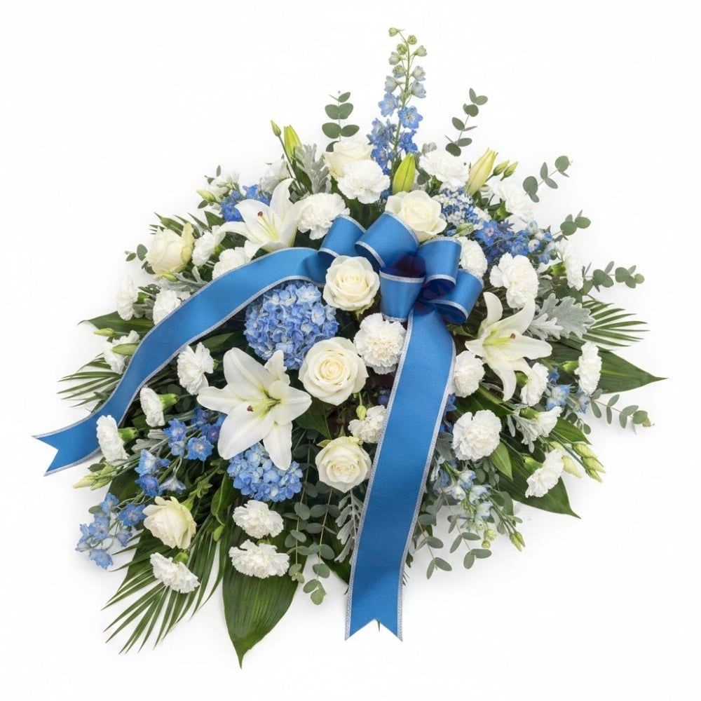 Composizione funebre con fiori bianchi e blu (raffinata)