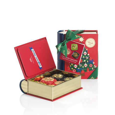 Mini libro di metallo contenente bocconcini di cioccolato Chocoviar al 75%, Crème Brûlée e Pistacchio.